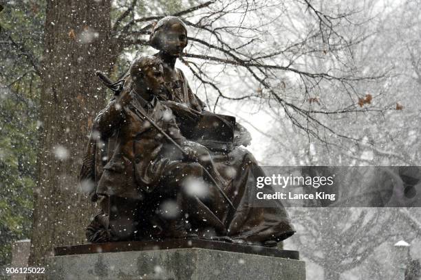 Snow falls on the Confederate Women's Monument at the State Capitol Grounds on January 17, 2018 in Raleigh, North Carolina. Governor Roy Cooper...