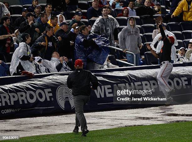 Melvin Mora of the Baltimore Orioles catches a pop up in foul territory against the New York Yankees during the game on September 11, 2009 at Yankee...