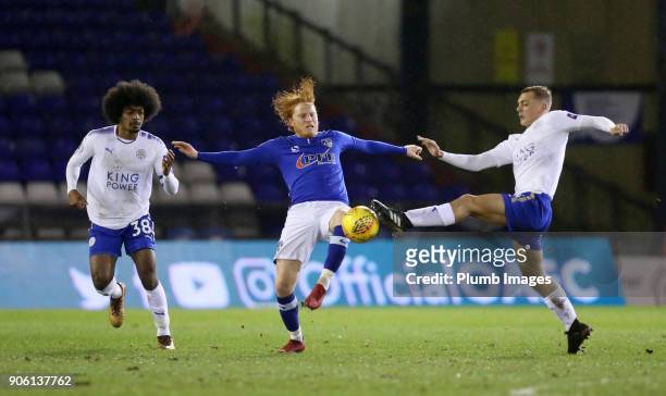 Kiernan Dewbury-Hall and Hamza Choudhury of Leicester City in action with Ben Pringle of Oldham Athletic during the Checkatrade Trophy tie between...
