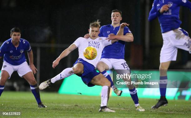 Sam Hughes of Leicester City in action with George Edmundson of Oldham Athletic during the Checkatrade Trophy tie between Oldham Athletic and...