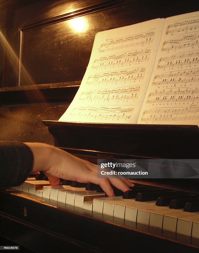 Girl playing on the piano