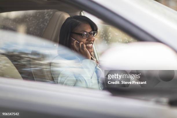 businesswoman working from car - steve prezant stock pictures, royalty-free photos & images