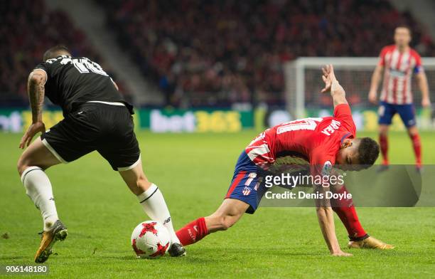 Ever Banega of Sevilla steals the ball from Angel Correa of Atletico de Madrid during the Copa del Rey, Quarter Final, First Leg match between...