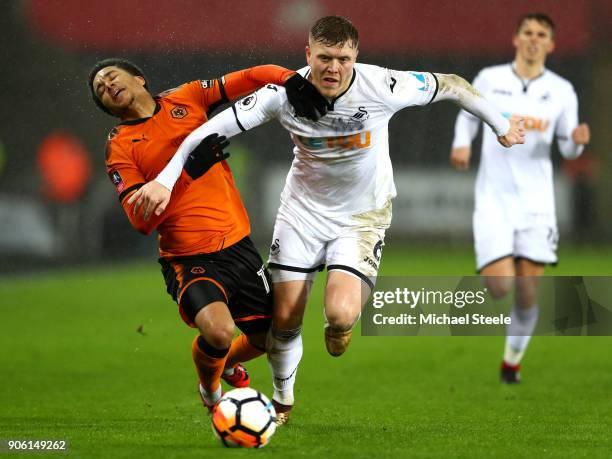 Helder Costa of Wolverhampton Wanderers is tackled by Alfie Mawson of Swansea City during The Emirates FA Cup Third Round Replay between Swansea City...