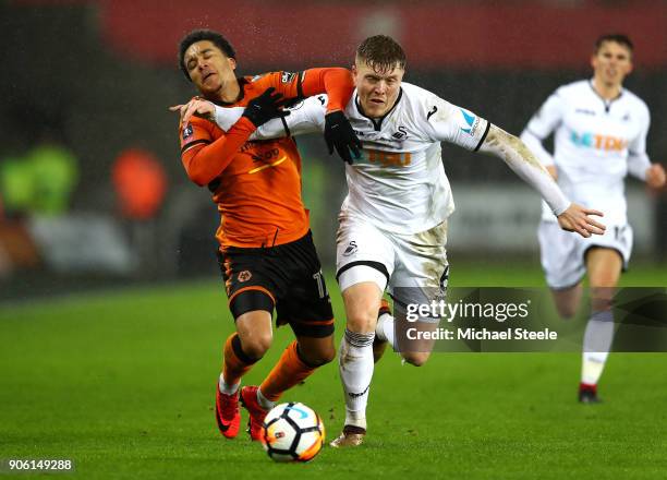 Helder Costa of Wolverhampton Wanderers is tackled by Alfie Mawson of Swansea City during The Emirates FA Cup Third Round Replay between Swansea City...