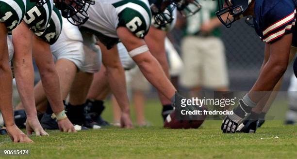 american football players at american football game - football line of scrimmage stock pictures, royalty-free photos & images