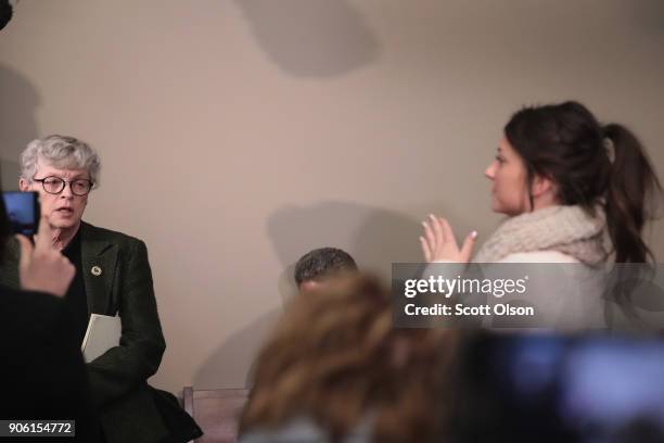 Michigan State University President Lou Anna Simon answers a question after being confronted by former MSU gymnast Lidsey Lemke during a break in the...