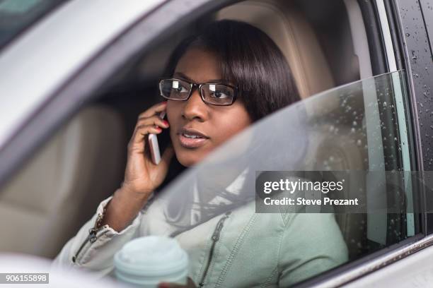 businesswoman working from car - steve prezant stock pictures, royalty-free photos & images