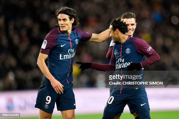 Paris Saint-Germain's Brazilian forward Neymar celebrates with Paris Saint-Germain's Uruguayan forward Edinson Cavani after scoring a free-kick...