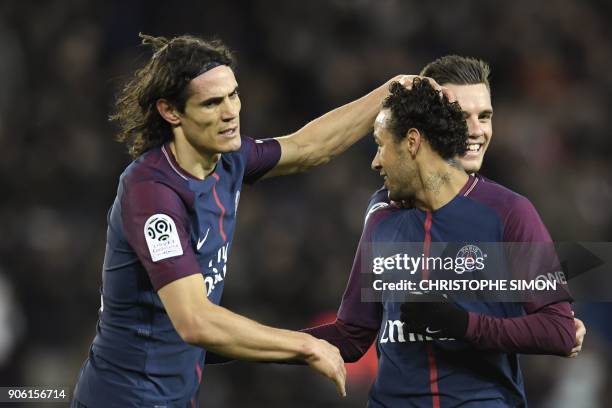 Paris Saint-Germain's Brazilian forward Neymar celebrates with Paris Saint-Germain's Uruguayan forward Edinson Cavani after scoring a free-kick...