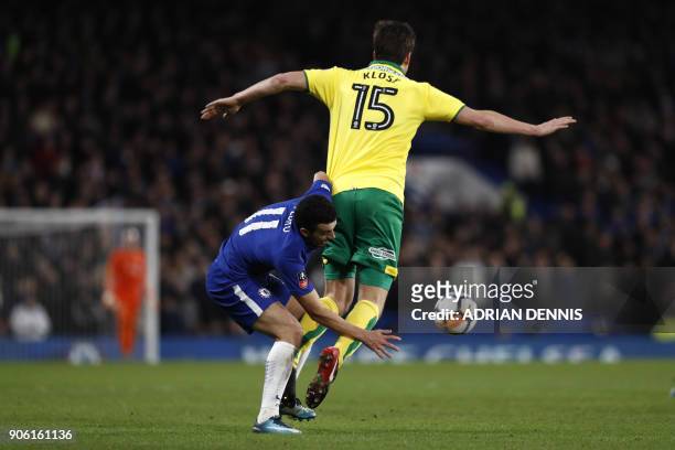 Chelsea's Spanish midfielder Pedro vies with Norwich City's German-born Swiss defender Timm Klose during the FA Cup third round replay football match...