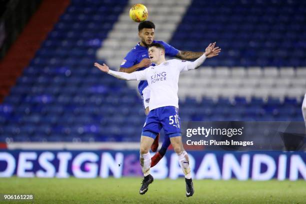 Connor Wood of Leicester City in action with Aaron Amadii-Holloway of Oldham Athletic during the Checkatrade Trophy tie between Oldham Athletic and...