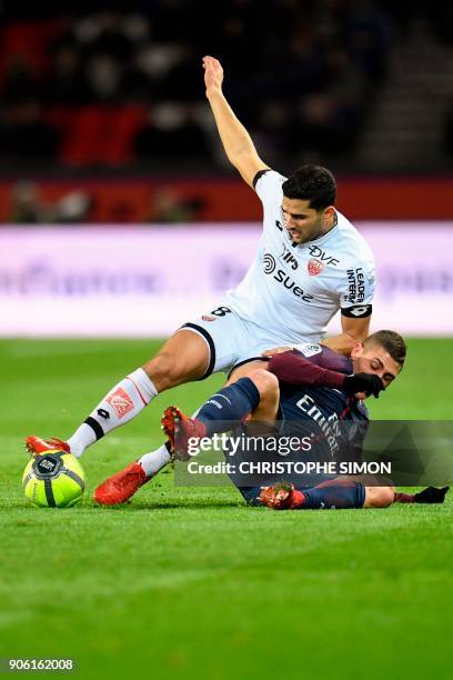 Dijon's French-Algerian midfielder Mehdi Abeid and Paris Saint-Germain's Italian midfielder Marco Verratti go for the ball during the French L1...