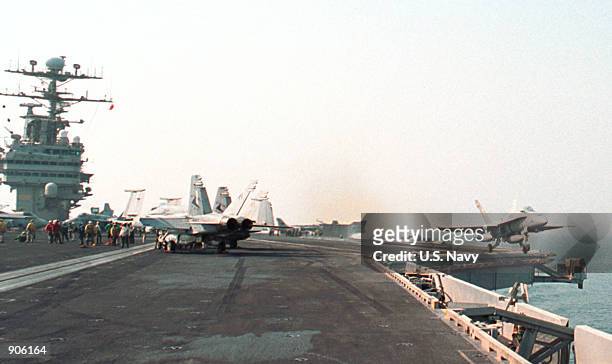 Hornet Strike" fighter jet launches from the flight deck of the aircraft carrier USS George Washington August 7, 2000 in the Arabian Gulf. The...