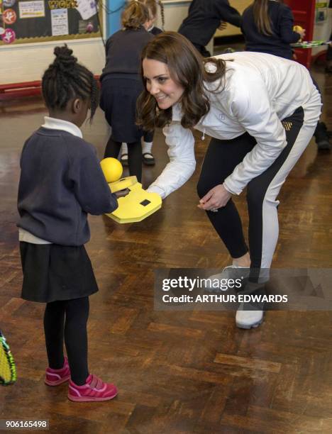 Britain's Catherine, Duchess of Cambridge and Patron of the All England Lawn Tennis and Croquet Club visits the Bond Primary School to see the work...