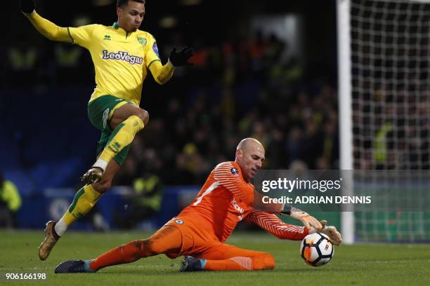 Chelsea's Argentinian goalkeeper Willy Caballero saves during the FA Cup third round replay football match between Chelsea and Norwich City at...