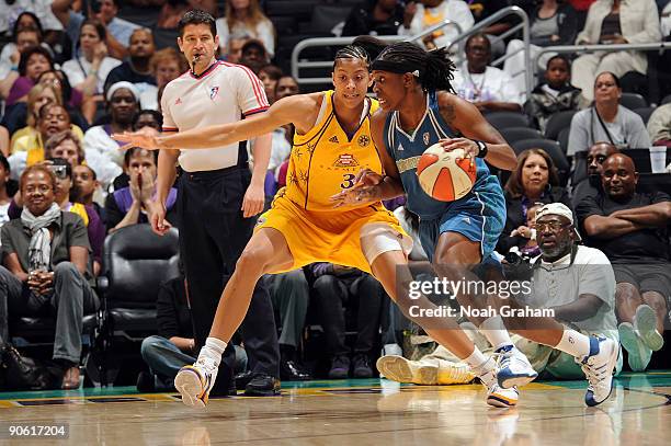 Roneeka Hodges of the Minnesota Lynx drives against Candace Parker of the Los Angeles Sparks on September 11, 2009 at Staples Center in Los Angeles,...