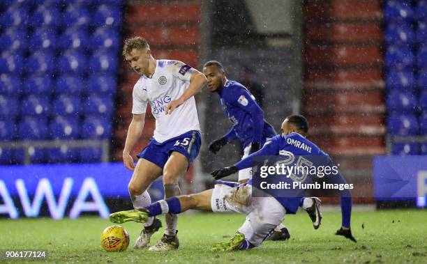 Sam Hughes of Leicester City in action with Abdelhakim Omrani of Oldham Athletic during the Checkatrade Trophy tie between Oldham Athletic and...