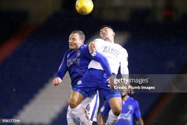 Josh Gordon of Leicester City in action with Brian Wilson of Oldham Athletic during the Checkatrade Trophy tie between Oldham Athletic and Leicester...