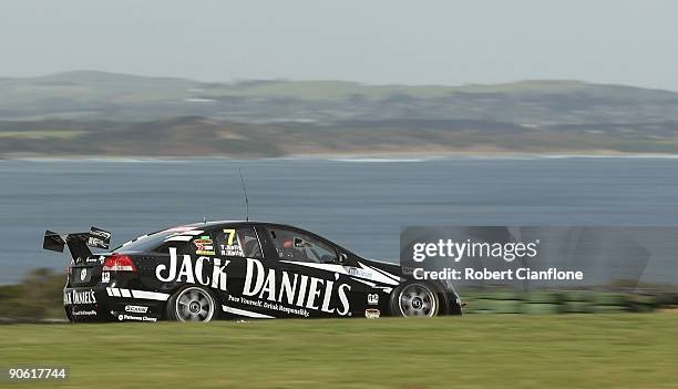 Todd Kelly driving the Kelly Racing Holden leads during race A for round nine of the V8 Supercar Championship Series at the Phillip Island Grand Prix...