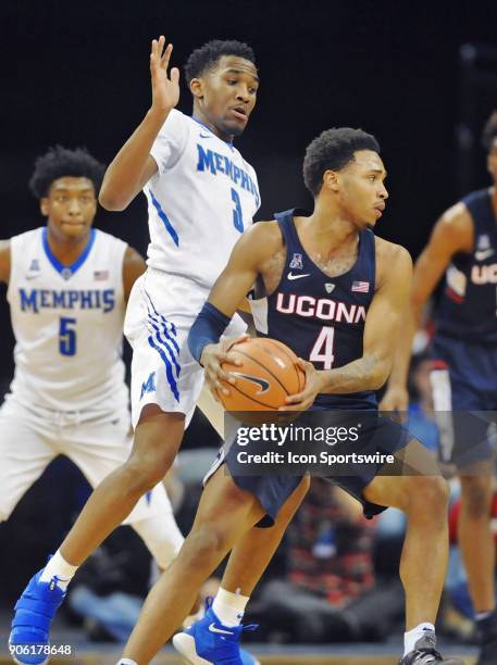 Memphis Tigers guard Jeremiah Martin defends UConn Huskies guard Jalen Adams during the first half of a college basketball game between the UConn...