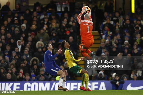 Chelsea's Argentinian goalkeeper Willy Caballero grasps the ball during the FA Cup third round replay football match between Chelsea and Norwich City...