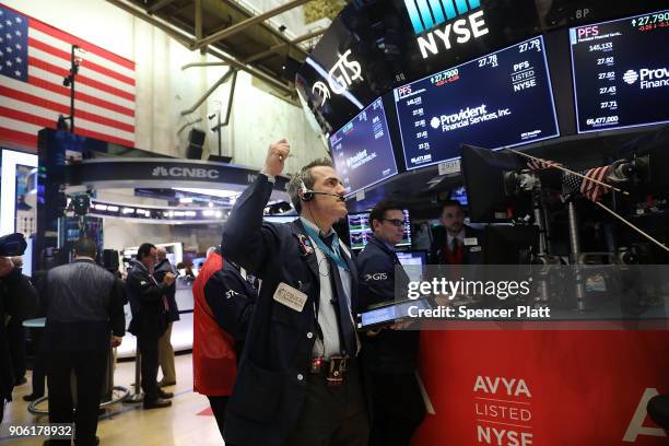 Traders work on the floor of the New York Stock Exchange on January 17, 2018 in New York City. The Dow Jones industrial average closed above 26,000...