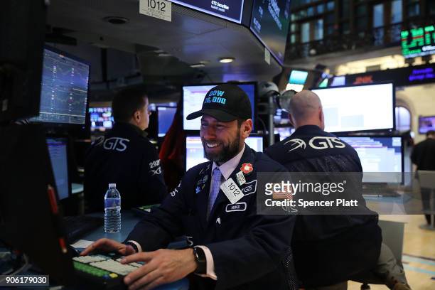 Traders work on the floor of the New York Stock Exchange on January 17, 2018 in New York City. The Dow Jones industrial average closed above 26,000...