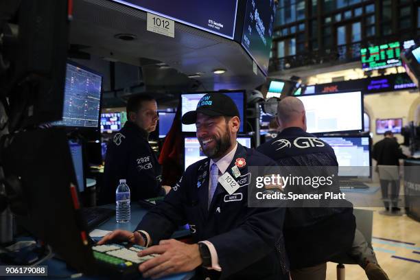 Traders work on the floor of the New York Stock Exchange on January 17, 2018 in New York City. The Dow Jones industrial average closed above 26,000...