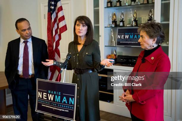 Marie Newman, center, candidate for Congress in IL-03, speaks during event to receive the endorsement of Reps. Jan Schakowsky, D-Ill., right, and...