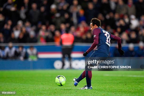 Paris Saint-Germain's Brazilian forward Neymar readies to shoot a penalty shot scoring the team's eighth goal during the French L1 football match...