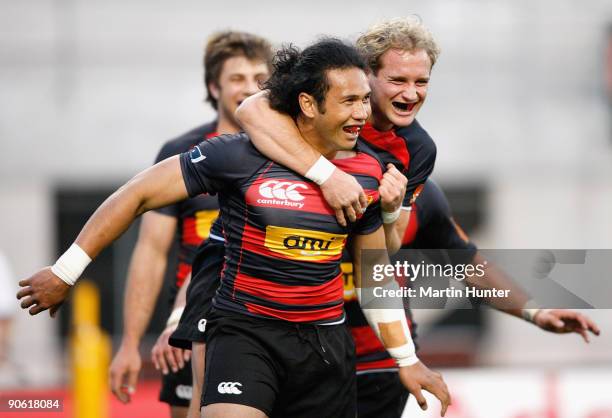 Casey Laulala of Canterbury celebrates scoring his try with team mate Andy Ellis during the Air New Zealand Cup match between Canterbury and Otago at...