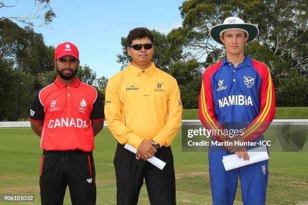 Arslan Khan of Canada, ICC Match Offical Devdas Govindjee and Lohan Louwrens of Namibia during the coin toss prior to the ICC U19 Cricket World Cup...