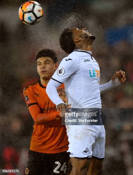 Swansea City player Leroy Fer beats Morgan Gibbs-White of Wolves during the Emirates FA Cup third round replay between Swansea City and Wolverhampton...