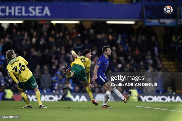 Norwich City's Northern Irish defender Jamal Lewis scores his team's first goal during the FA Cup third round replay football match between Chelsea...