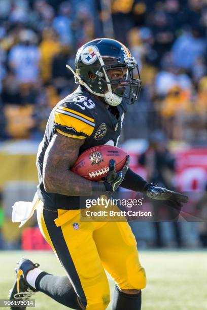 Fitzgerald Toussaint of the Pittsburgh Steelers runs with the ball during the second quarter against the Jacksonville Jaguars in the AFC Divisional...