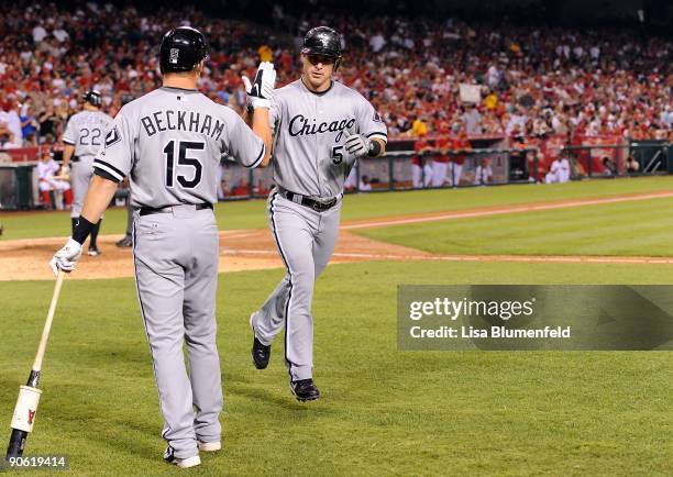 Jayson Nix of the Chicago White Sox is congratulated by teammate Gordon Beckham after hitting a homerun in the third inning against the Los Angeles...