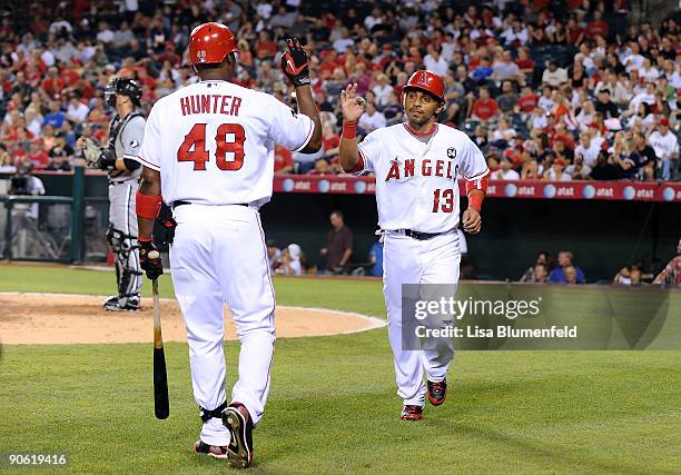 Maicer Izturis of the Los Angeles Angels of Anaheim scores in the first inning against the Chicago White Sox at Angel Stadium of Anaheim on September...