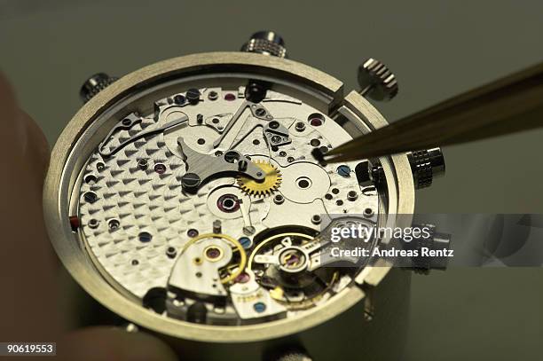 Watch maker of German watch manufacturer Glashuette Original works on an exemplar of the 'Glashuette Original Senator' watch on December 19, 2007 in...