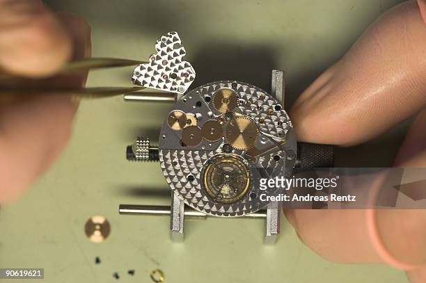 Watch maker of German watch manufacturer Glashuette Original works on an exemplar of the 'Glashuette Original Senator' watch on December 19, 2007 in...