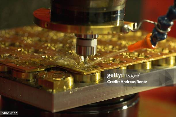 Machine mills on a component part at German watch manufacturer Glashuette Original on December 19, 2007 in Glashuette, near Dresden, Germany....