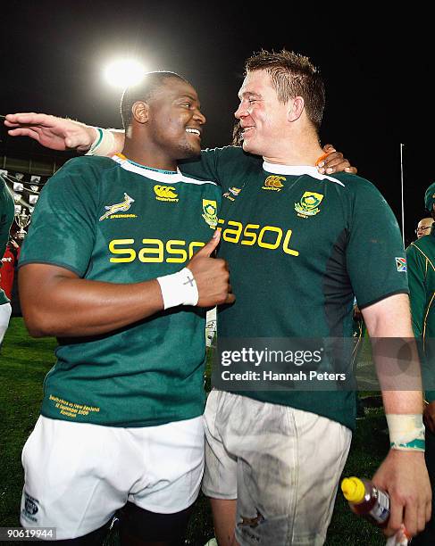 Chiliboy Ralepelle celebrates with team mate John Smit of South Africa after winning the Tri Nations Test Match between the New Zealand All Blacks...