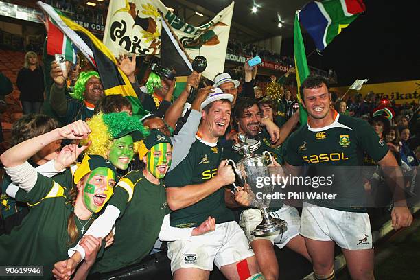 Bakkies Botha and Victor Matfield of South Africa celebrate with the Tri Nations Cup following the Tri Nations Test between the New Zealand All...