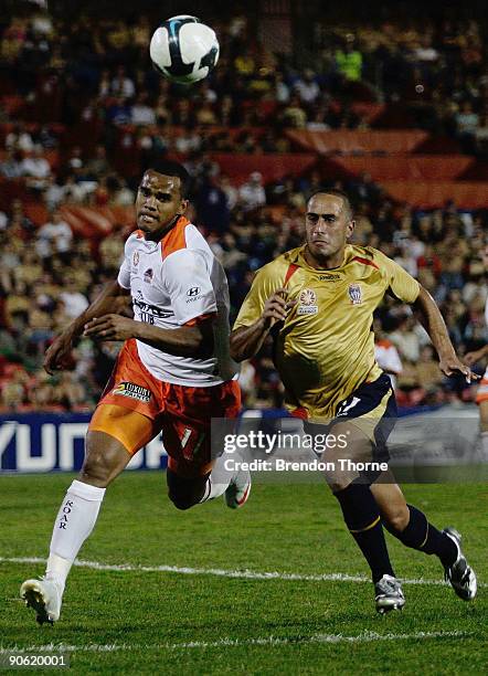 Tarek Elrich of the Jets competes with Reinaldo of the Roar during the round six A-League match between the Newcastle Jets and the Brisbane Roar at...