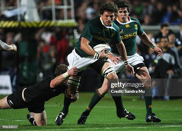Ryan Kankowski of South Africa is tackled during the Tri Nations Test between the New Zealand All Blacks and South African Springboks at Waikato...