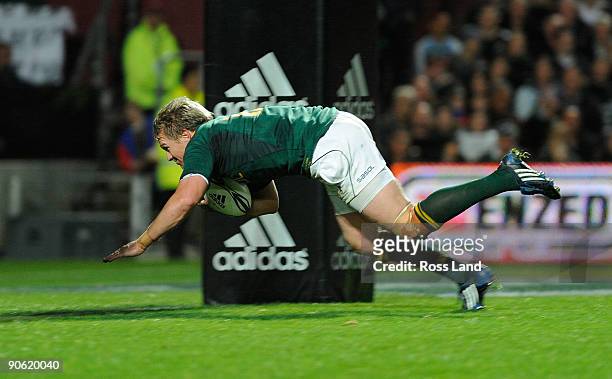 Jean De Villiers of South Africa dives in to score a try during the Tri Nations Test between the New Zealand All Blacks and South African Springboks...
