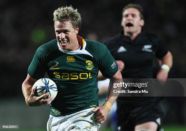 Kieran Read of New Zealand fails to catch Jean de Villiers of South Africa before he scored a try during the Tri Nations Test between the New Zealand...