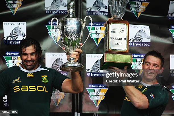 Victor Matfield and John Smit hold the Tri Nations and Freedom Cups following the Tri Nations Test between the New Zealand All Blacks and South...