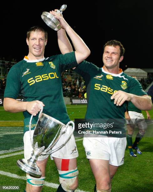 Bakkies Botha and Bismarck Du Plessis of South Africa celebrate with the Tri Nations trophy after winning the Tri Nations Test Match between the New...