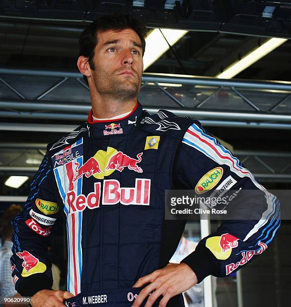 Mark Webber of Australia and Red Bull Racing prepares in his team garage during the final practice session prior to qualifying for the Italian...